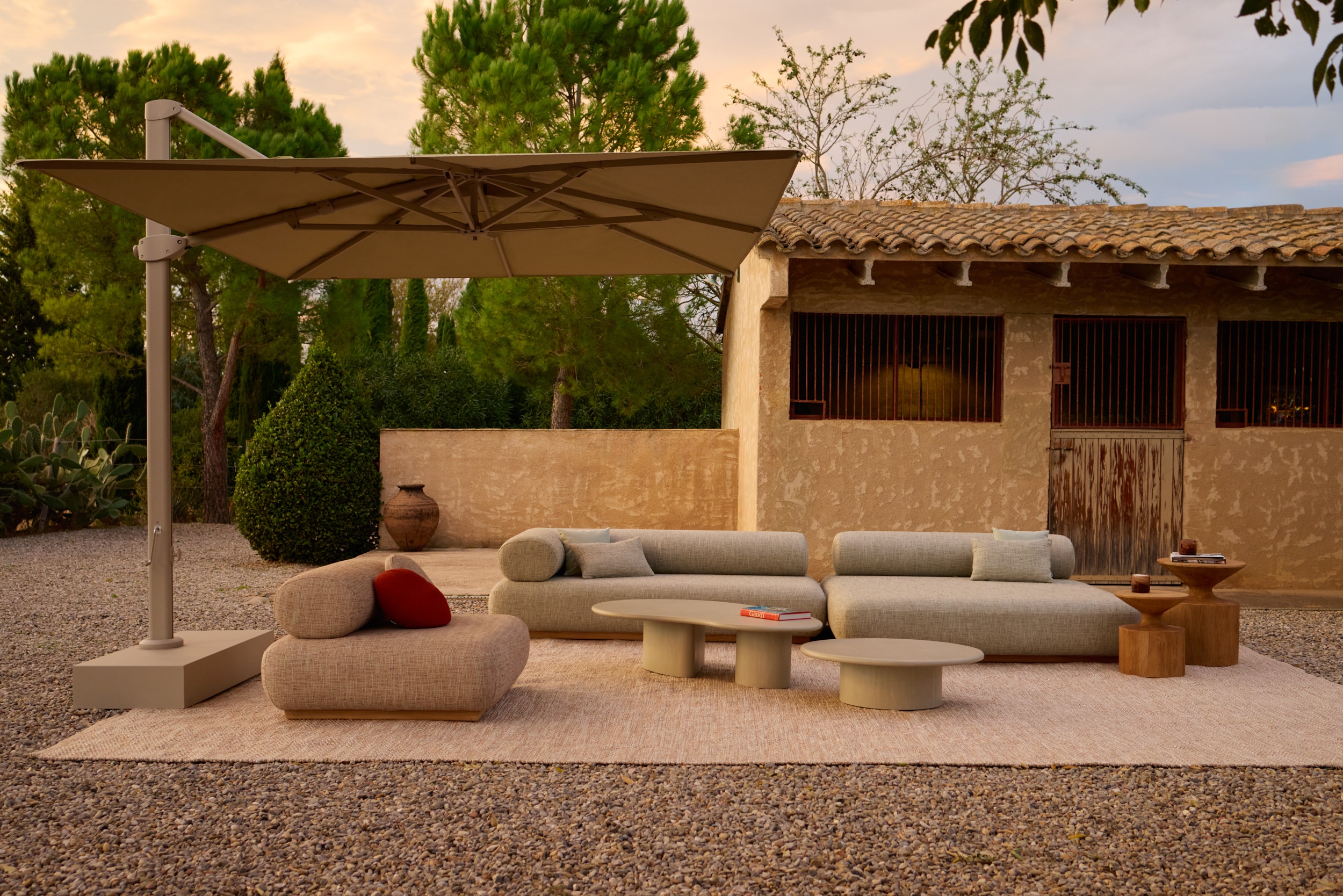 A Jardinico outdoor setting with parasol and lounge furniture